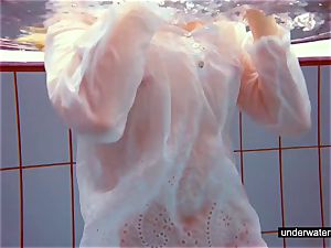 adorable ginger-haired plays bare underwater