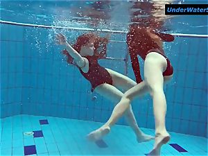 2 torrid teenagers underwater